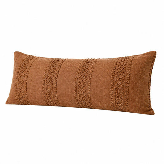 Cuscino rettangolare 60 x 30 cm in tessuto terracotta con texture decorativa